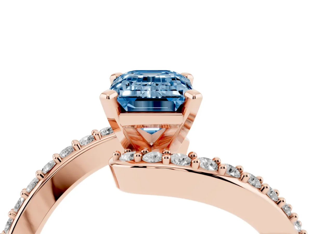 Fancy Blue Emerald Cut Solitaire Twist Band with Pave Set Diamonds and Four-Prong Setting Rose gold