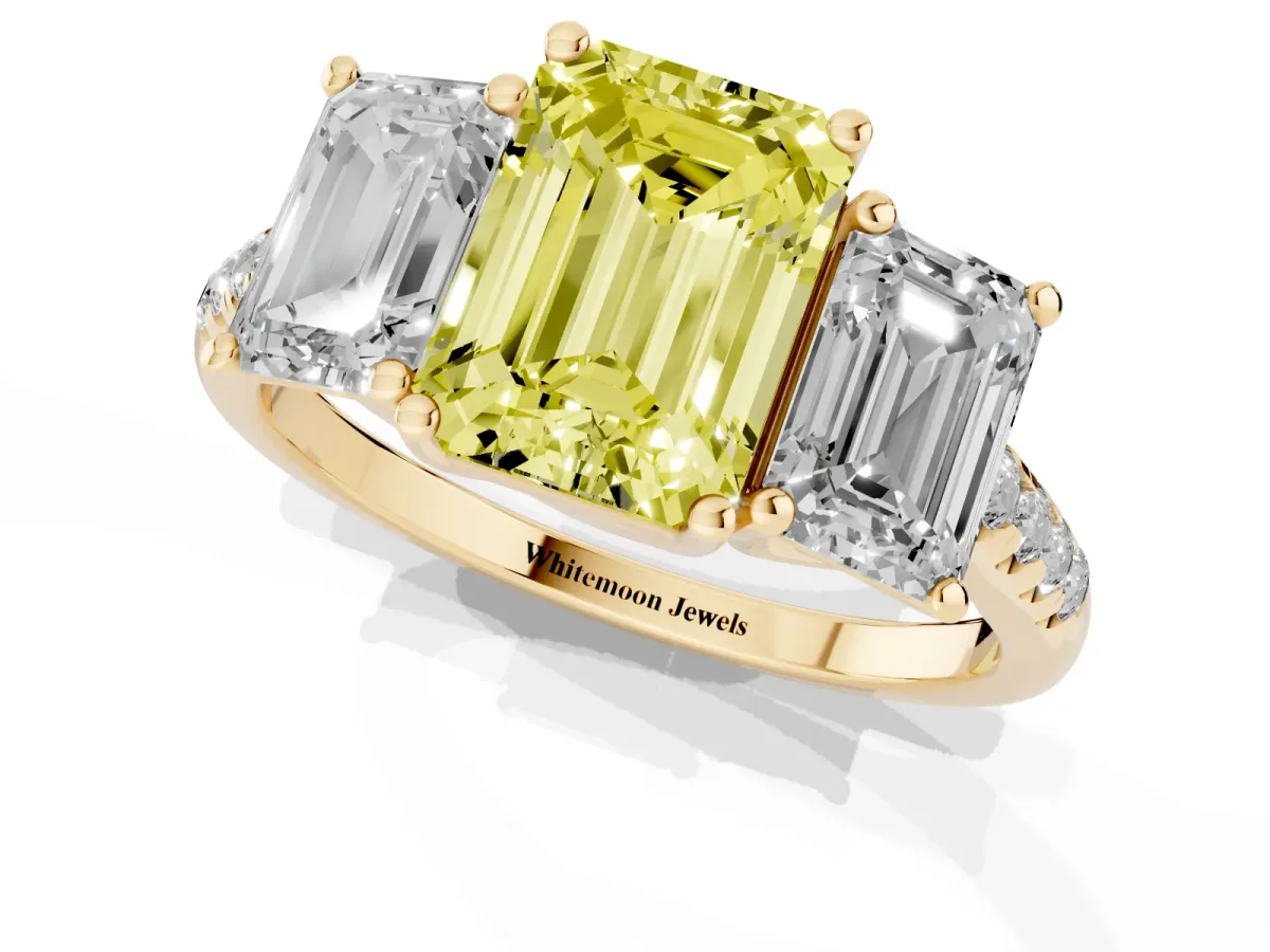 Fancy Yellow Three-Stone Emerald Cut Diamond Ring with Round Pavé Band and Prong Setting Yellow gold