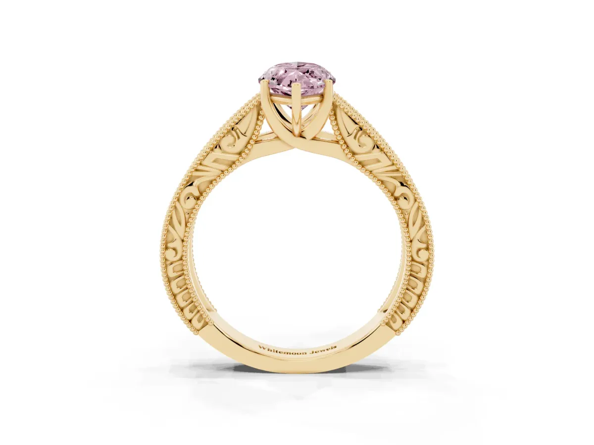 Fancy Pink Marquise Cut Diamond Solitaire Ring with Engraved Band and Four-Prong Setting Yellow gold