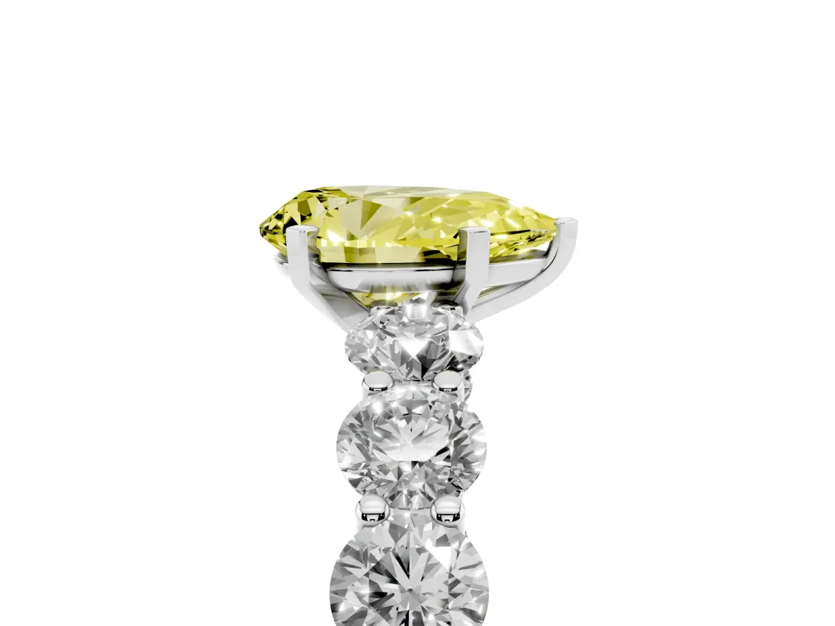 Fancy Yellow Pear Cut Diamond Prong Setting with Side Stones on a Pave Band Silver