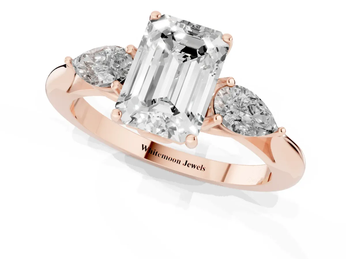 Three-Stone Emerald Cut Brilliant Diamond Solitaire Ring with Tapered Band and Four-Prong Setting Rose gold