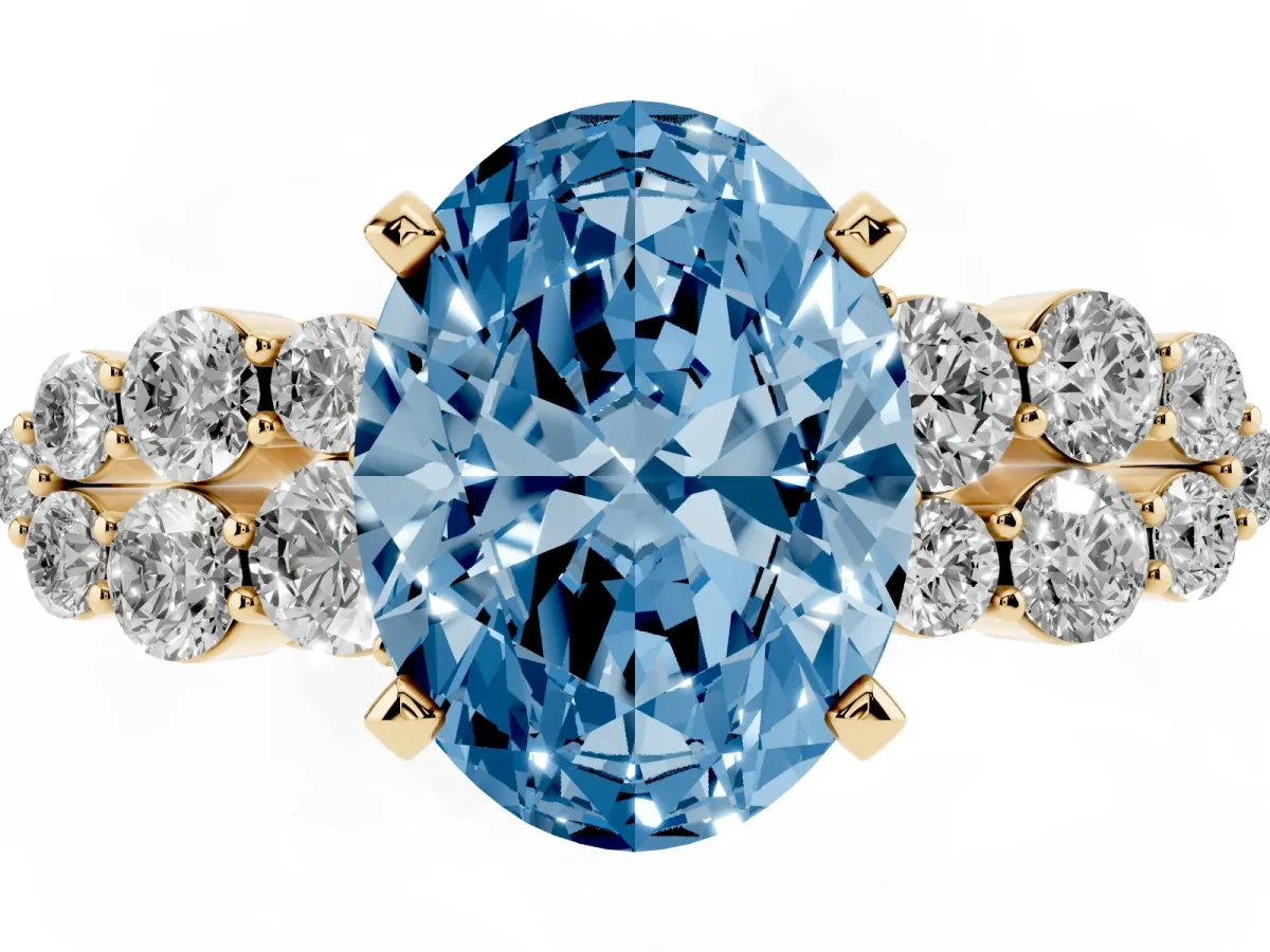 Fancy Blue Oval Cut Cluster Diamond Engagement Ring with Pavé Band and Four-Prong Setting Yellow gold