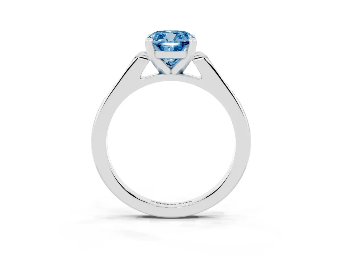 Fancy Blue Cushion Cut Diamond Solitaire Ring with Channel Set Round Band and Prong Setting Silver