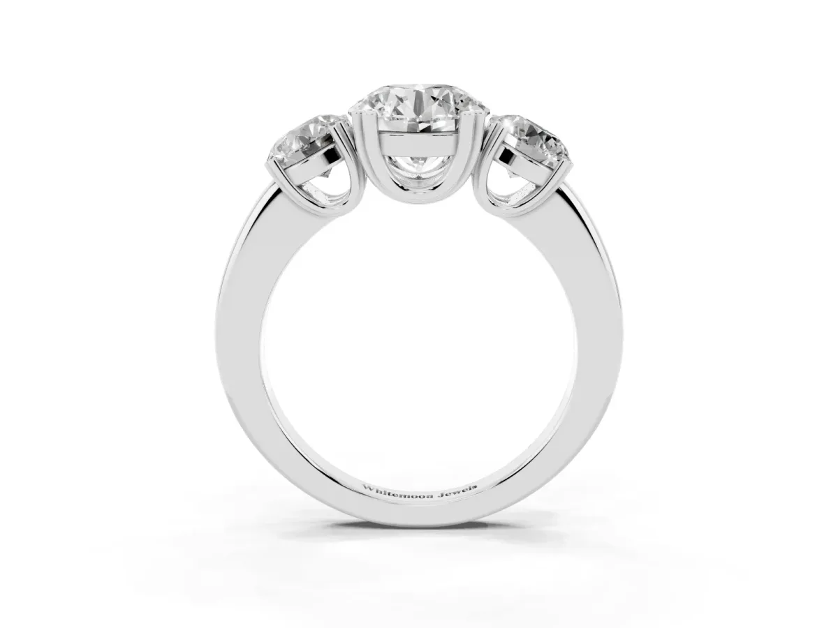 Three-Stone Round Cut Cut Diamond Ring with Channel Set Band and Four-Prong Setting Silver