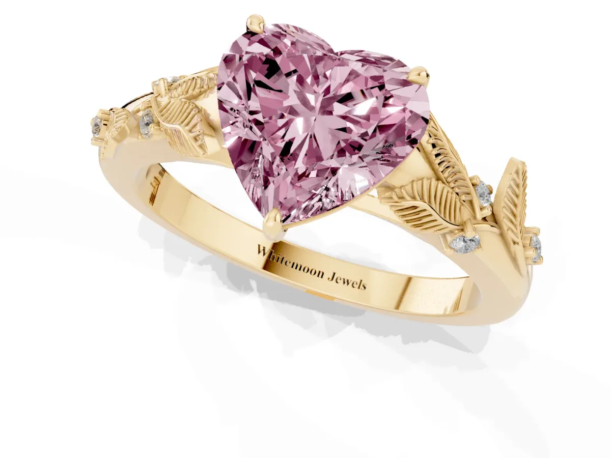 Fancy Pink Heart Cut Diamond Solitaire Ring with Leaf Motif Band and Four-Prong Setting Yellow gold