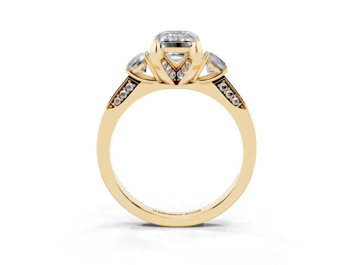 Emerald Cut Brilliant Three-Stone Diamond Ring with Pavé Band and Four-Prong Setting Yellow gold