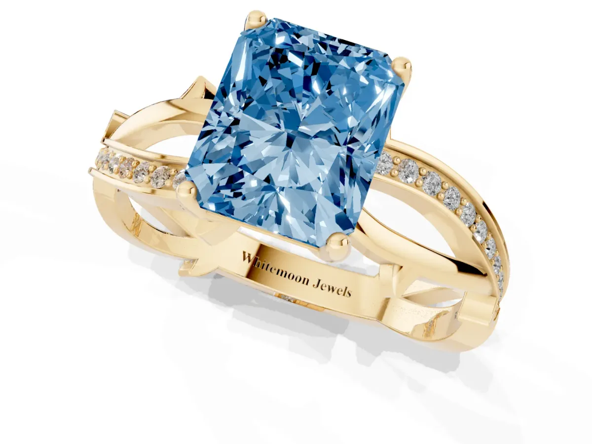 Fancy Blue Radiant Cut Solitaire Twist Band with Pavé Accents and Four-Prong Setting Yellow gold
