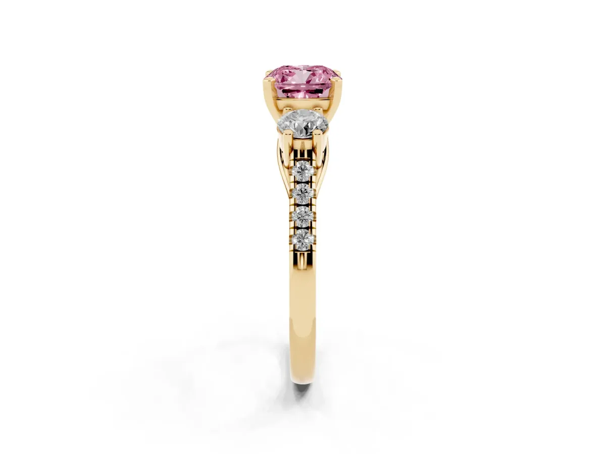 Fancy Pink Three-Stone Cushion Cut Diamond Pavé Band with Four-Prong Setting Yellow gold
