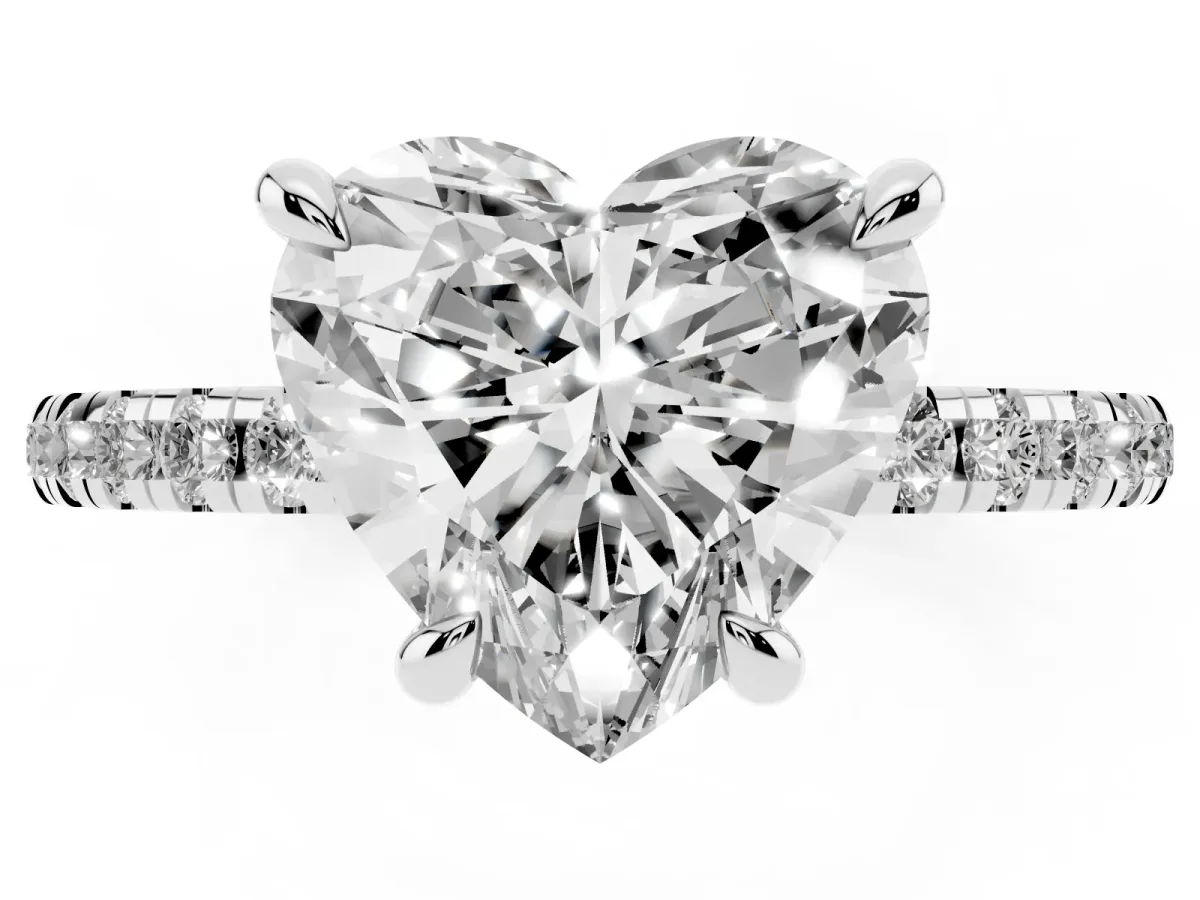 Heart Cut Diamond Brilliant Solitaire Ring with Pavé Band and Four-Prong Setting Silver