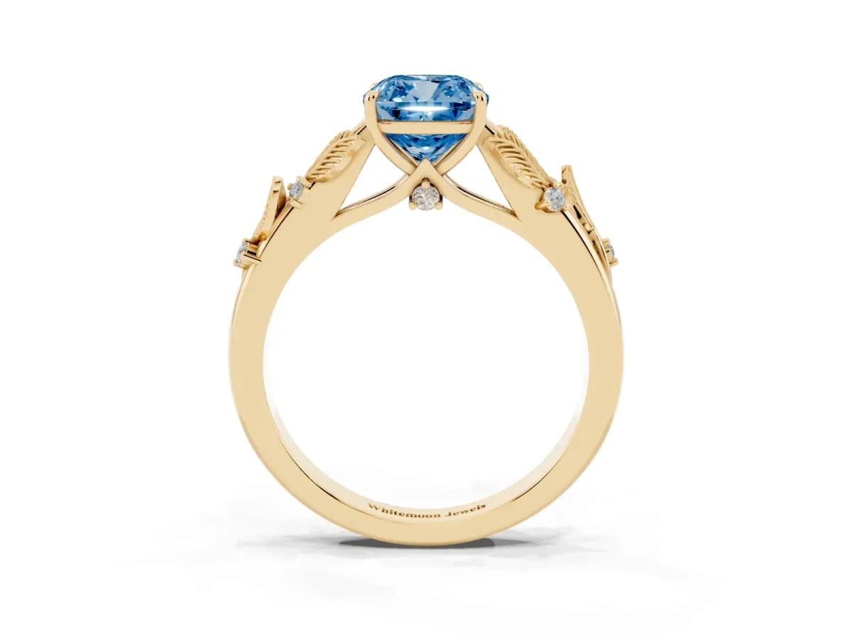 Fancy Blue Cushion Cut Diamond Solitaire Ring with Leaf Motif Band and Four-Prong Setting Yellow gold