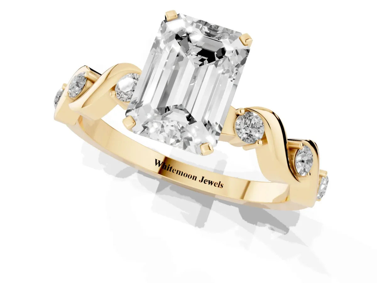 Emerald Cut Diamond Solitaire Twisted Band with Round Accents and Prong Setting Yellow gold