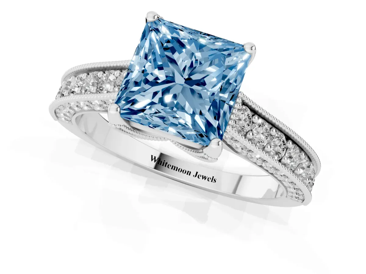 Fancy Blue Princess Cut Cut Diamond Solitaire Ring with Milgrain Pave Band and Four Prong Setting Silver