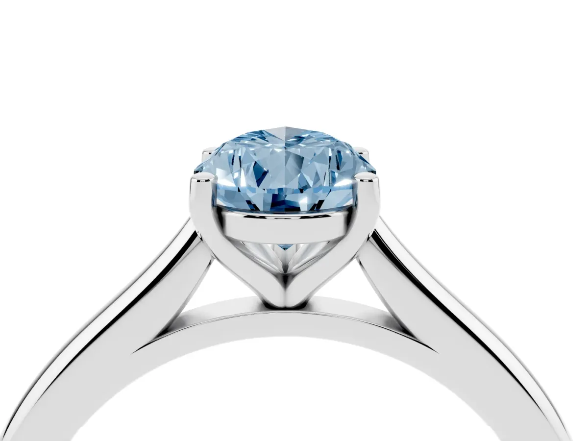 Fancy Blue Pear Cut Cut Solitaire Ring with Cathedral Band and Four-Prong Setting Silver
