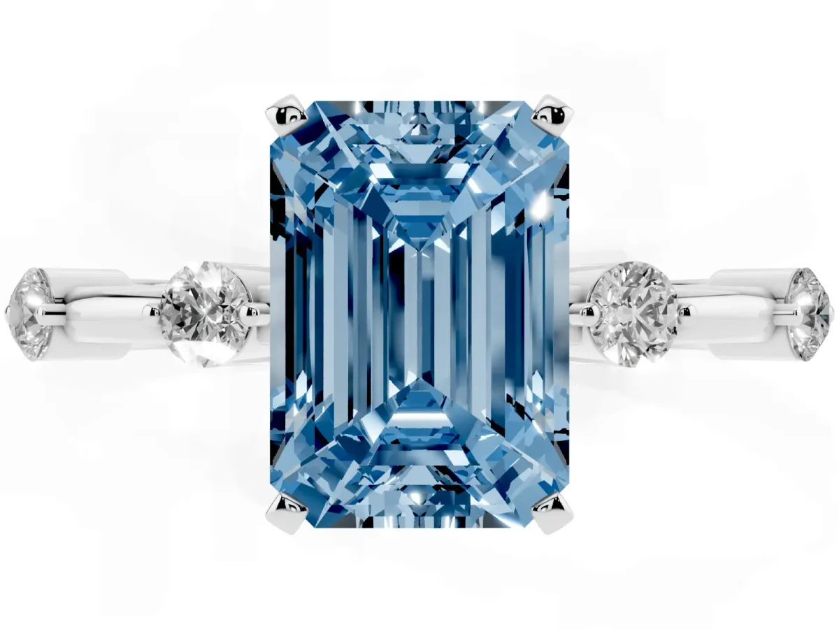 Fancy Blue Emerald Cut Solitaire Diamond Ring with Bezel Set Side Stones and Prong Setting Silver