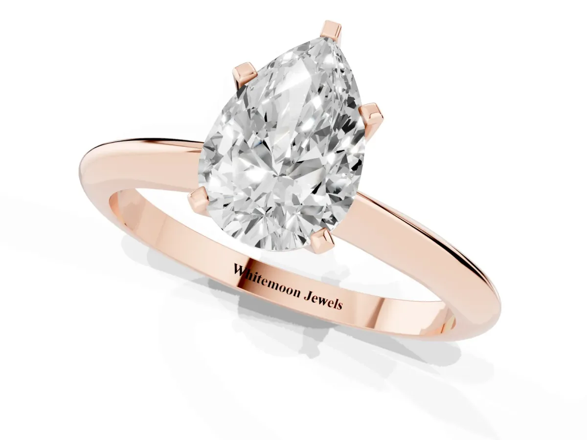 Pear Cut Cut Solitaire Ring with Four-Prong Setting on a Classic Band Rose gold