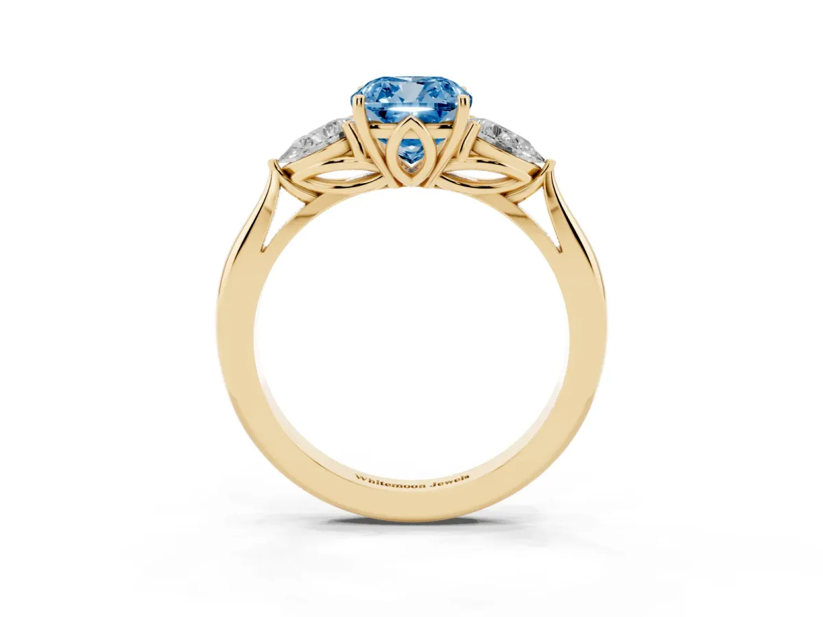 Fancy Blue Cushion Cut Diamond Three-Stone Ring with Pear Side Stones and Prong Setting Yellow gold