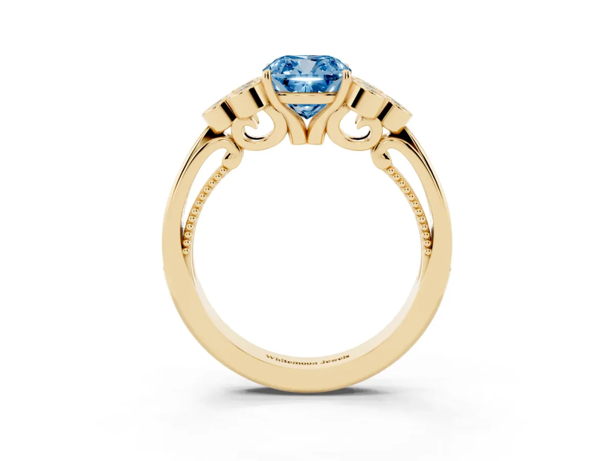 Fancy Blue Cushion Cut Cut Diamond Engagement Ring with Bezel Set Round Side Stones and Prong Setting Yellow gold