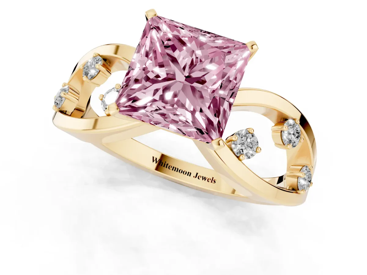 Fancy Pink Princess Cut Cut Solitaire Diamond with Side Stones on Criss-Cross Band and Four-Prong Setting Yellow gold