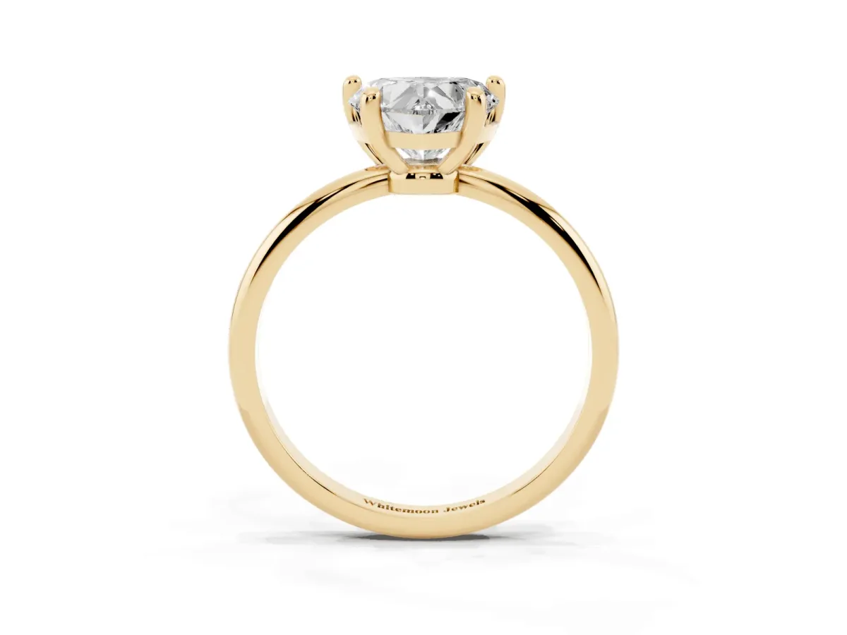 Heart Cut Solitaire Diamond Ring with 4-Prong Setting on a Classic Band Yellow gold