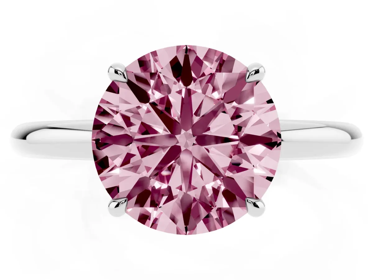 Fancy Pink Round Cut Diamond Solitaire Ring with Thin Band and Four-Prong Setting Silver