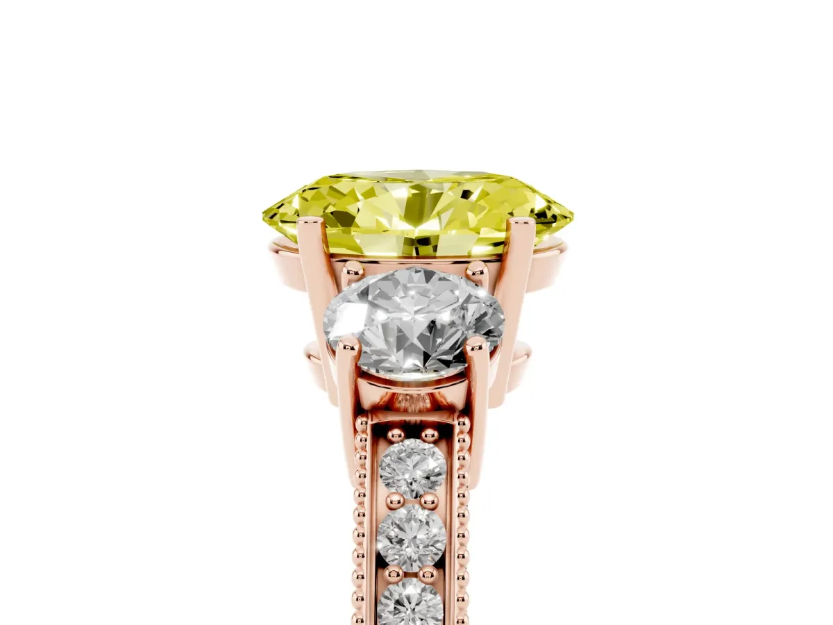 Fancy Yellow Oval Cut Three-Stone Diamond Ring with Pavé Band and Four-Prong Setting Rose gold