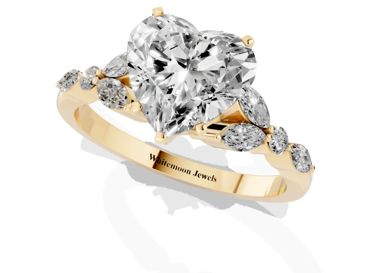 Heart Cut Diamond Solitaire Ring with Side Stones and Four-Prong Setting Yellow gold