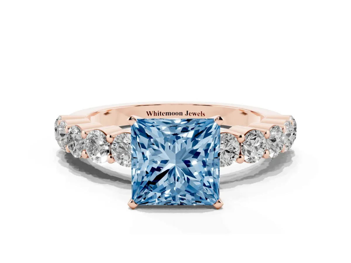 Fancy Blue Princess Cut Diamond Solitaire Ring with Shared Prong Round Side Stones Rose gold