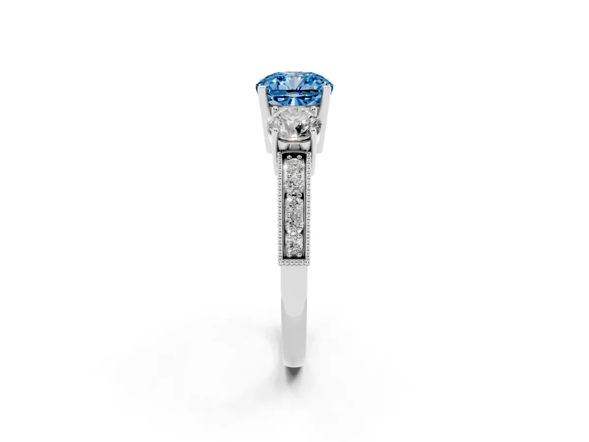 Fancy Blue Cushion Cut Three-Stone Diamond Ring with Pavé Band and Four-Prong Setting Silver