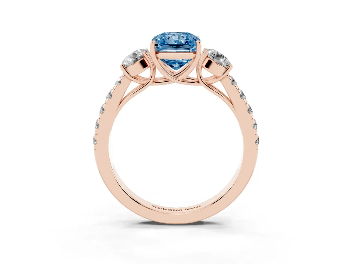 Fancy Blue Radiant Cut Cut Diamond Three-Stone Ring with Round Side Stones and Pavé Band Rose gold