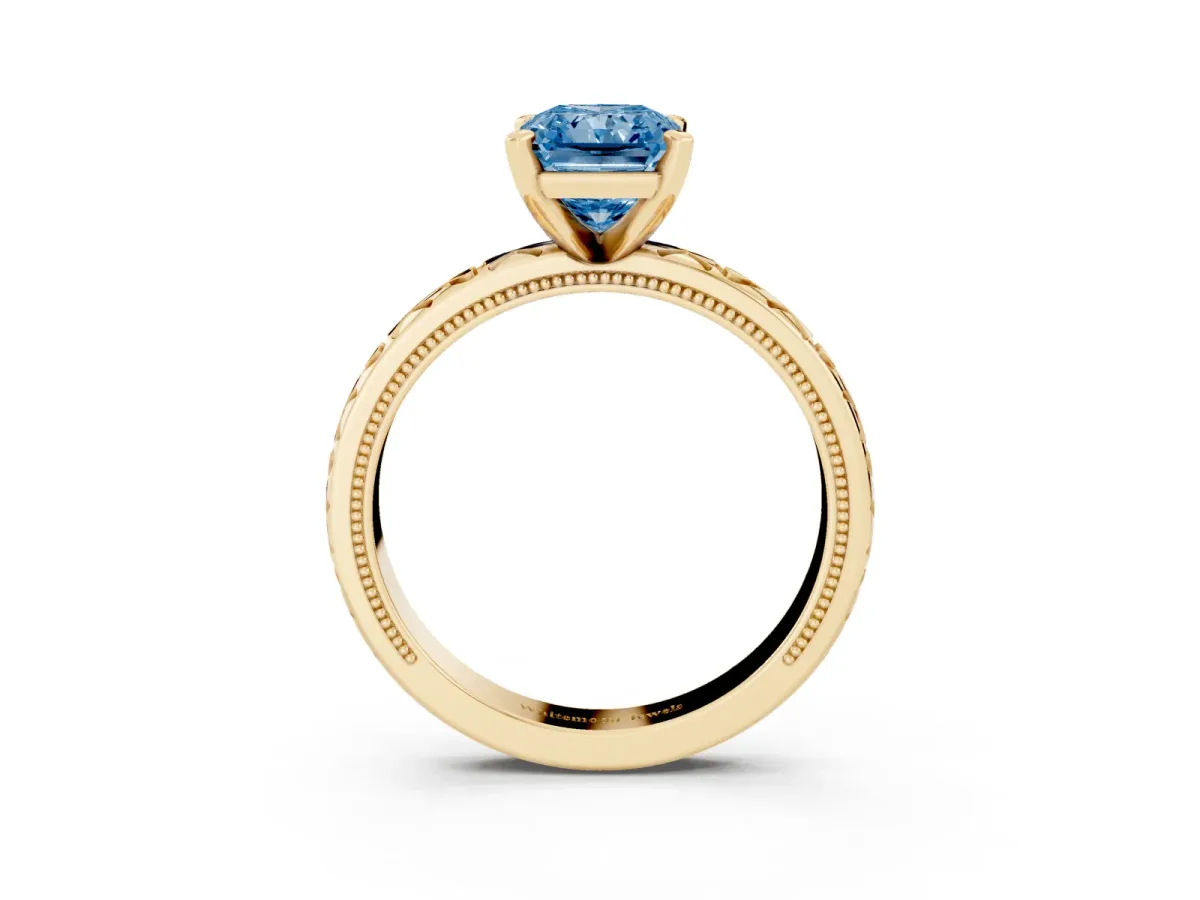 Fancy Blue Radiant Cut Solitaire Diamond Engagement Ring with XO Engraved Band and Four-Prong Setting Yellow gold