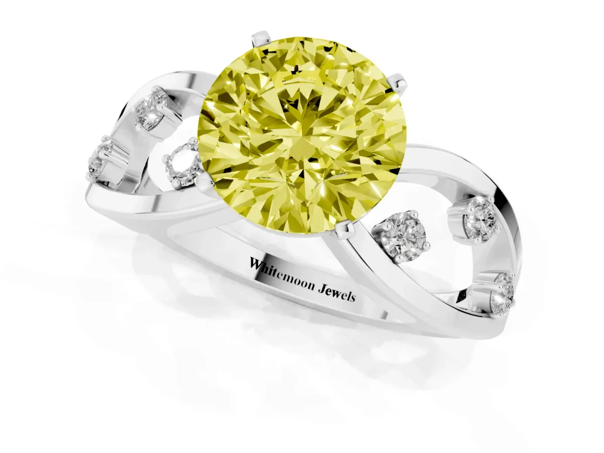 Fancy Yellow Round Cut Cut Solitaire Diamond with Side Stones on Criss-Cross Band and Four-Prong Setting Silver