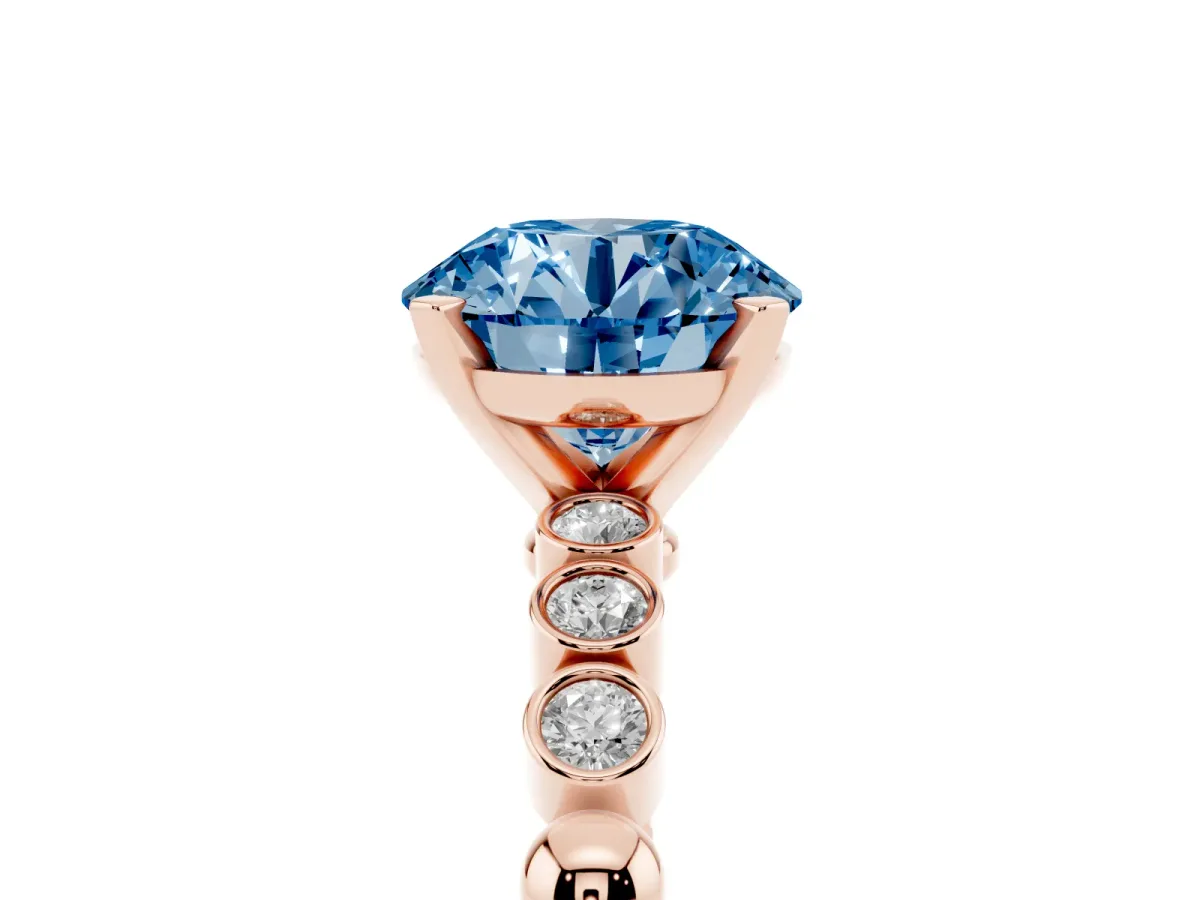 Fancy Blue Round Cut Solitaire Bezel Accent Diamond Engagement Ring with Beaded Band and Four-Prong Setting Rose gold