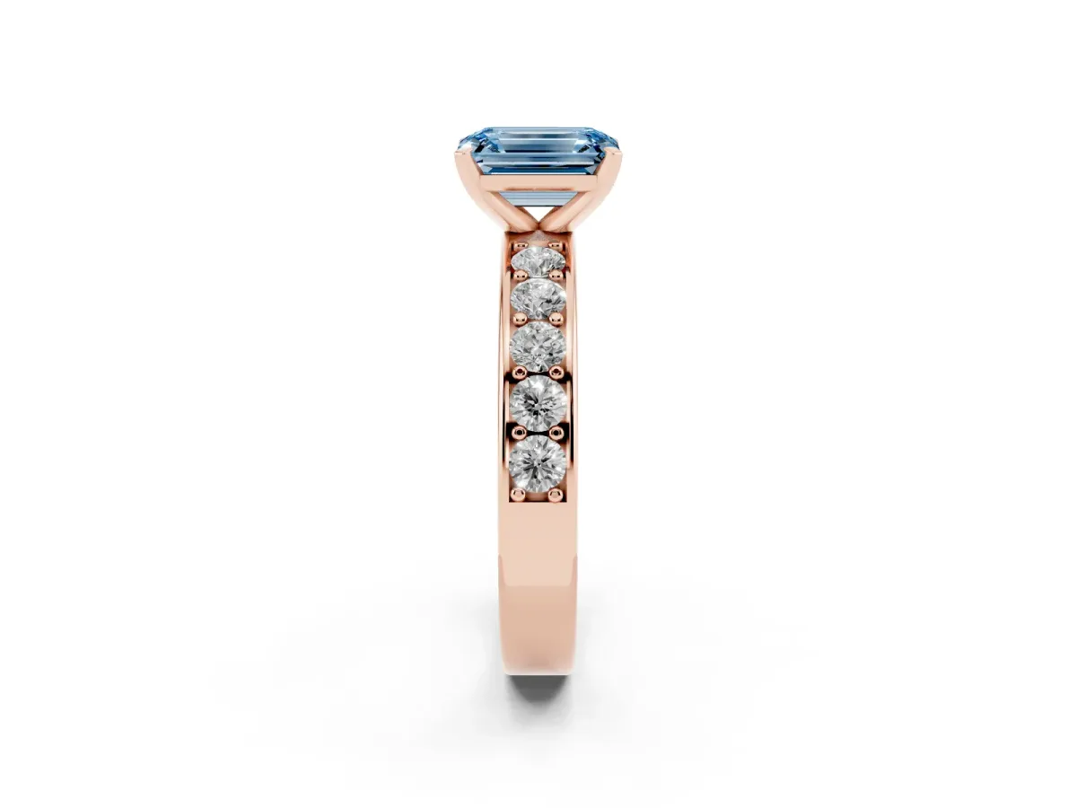 Fancy Blue Emerald Cut Diamond Engagement Ring with Channel Set Round Band and Prong Setting Rose gold
