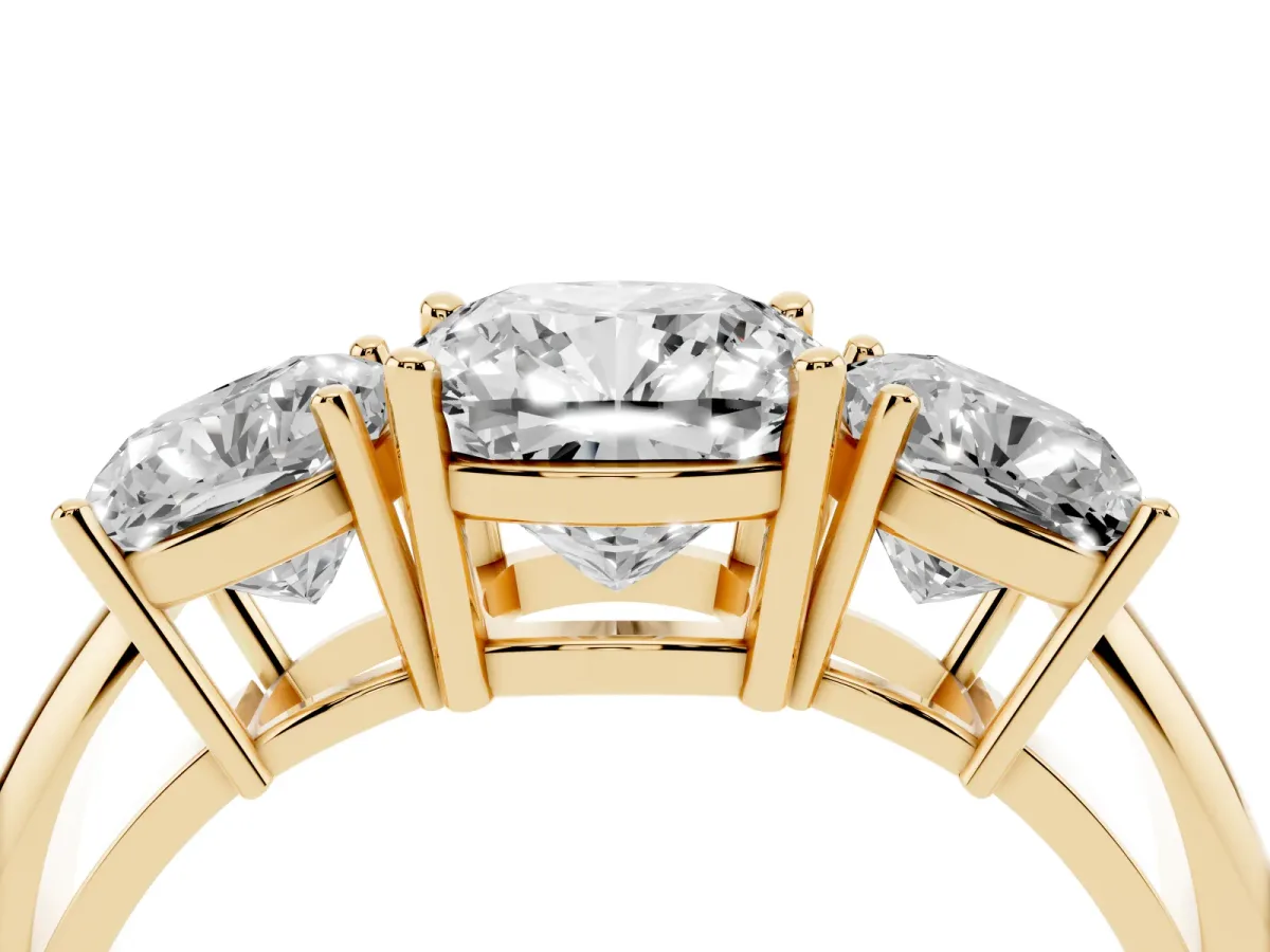 Three-Stone Cushion Cut Cut Diamond Engagement Ring with Prong Setting on a White Gold Band Yellow gold