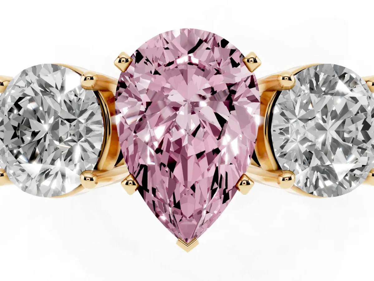 Fancy Pink Three-Stone Pear Cut Diamond Ring with Round Side Stones, Classic Band, and Four-Prong Setting Yellow gold