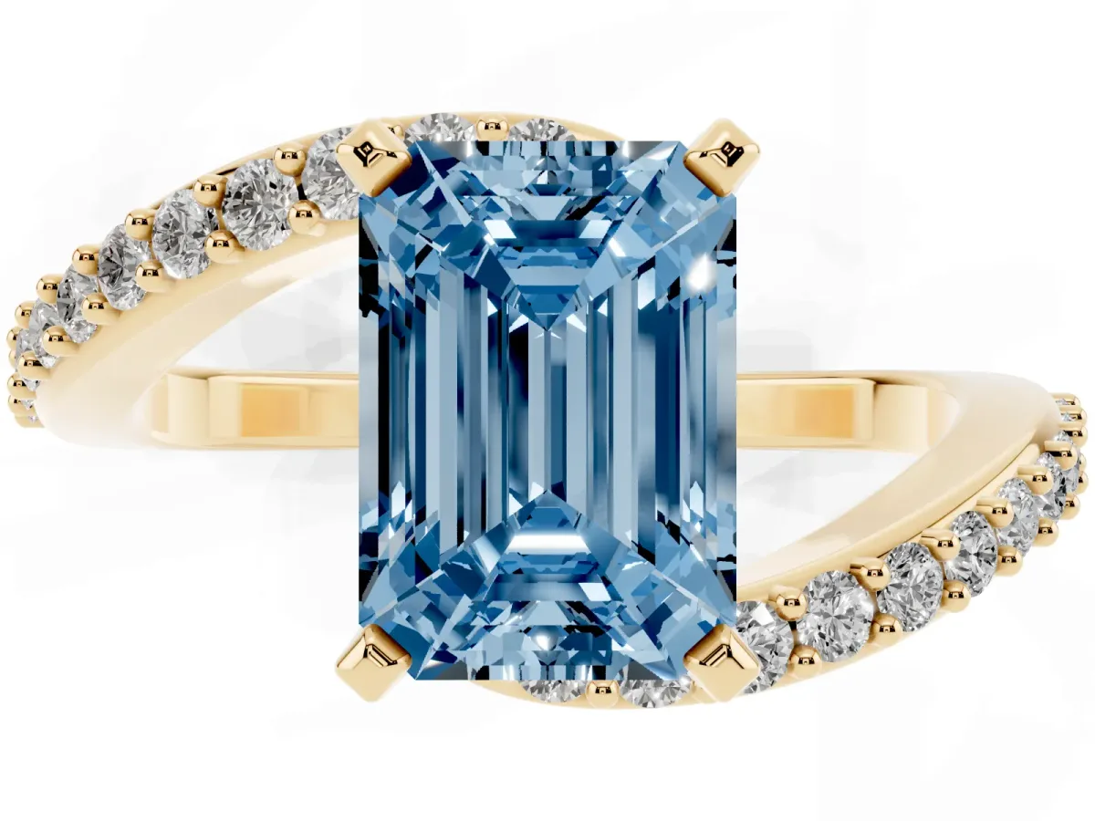 Fancy Blue Emerald Cut Solitaire Twist Band with Pave Set Diamonds and Four-Prong Setting Yellow gold