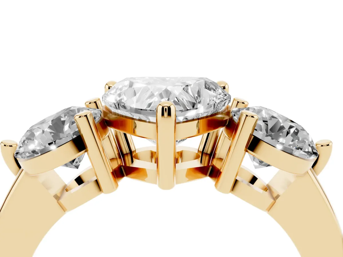 Three-Stone Heart Cut Brilliant Cut Solitaire Ring with Prong Setting on a Classic Band Yellow gold