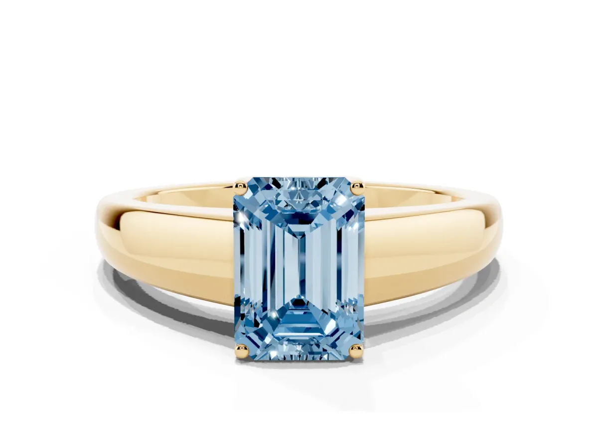 Fancy Blue Emerald Cut Solitaire Diamond Ring with Tapered Band and Four-Prong Setting Yellow gold
