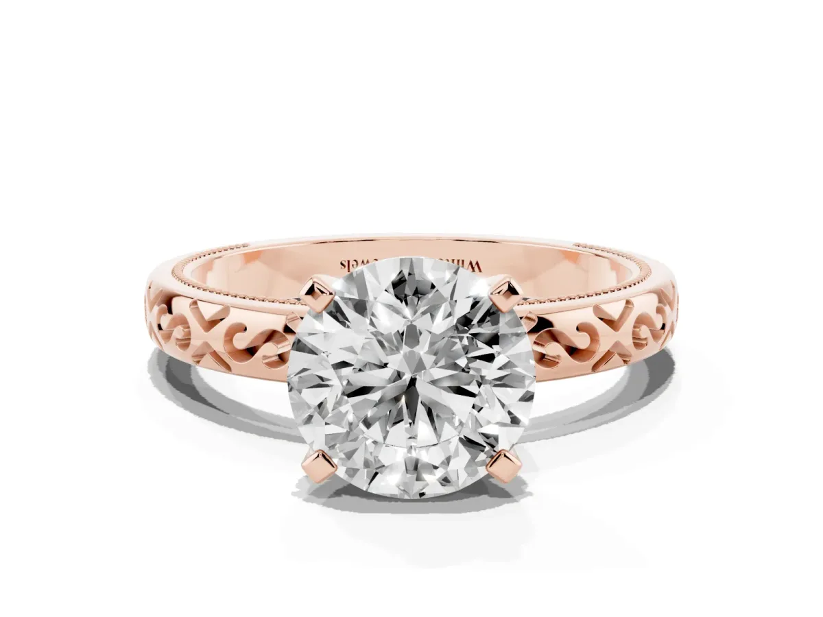 Round Cut Solitaire Engagement Ring with Scrollwork Band and Four-Prong Setting Rose gold
