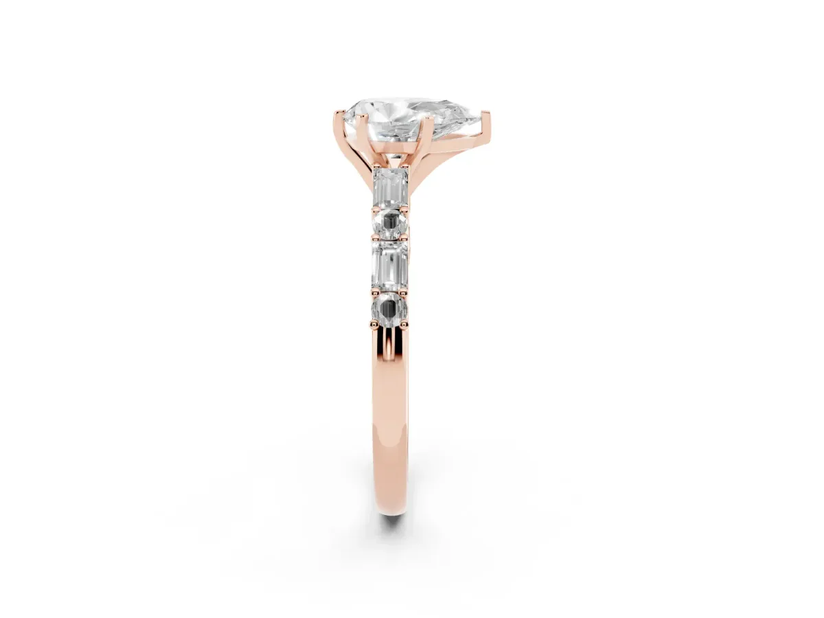 Pear Cut Diamond Solitaire with Side Baguettes and Channel Set Band Rose gold