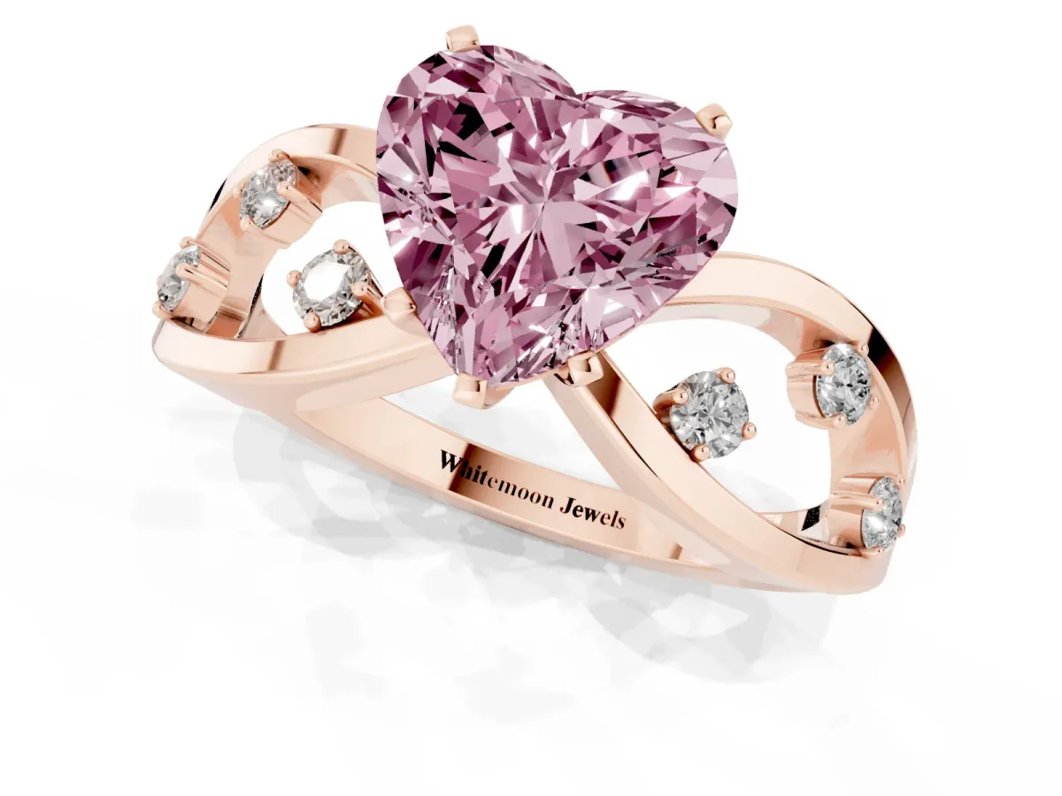 Fancy Pink Heart Cut Cut Solitaire Diamond with Side Stones on Criss-Cross Band and Four-Prong Setting Rose gold