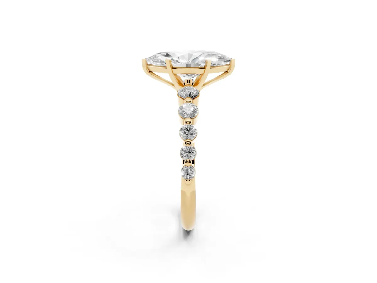 Marquise Cut Solitaire Diamond Ring with Pave Band and Four-Prong Setting Yellow gold