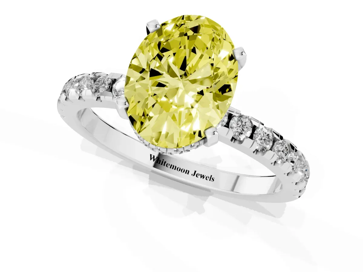 Fancy Yellow Oval Cut Diamond Solitaire Ring with Round Pavé Band and Four-Prong Setting Silver