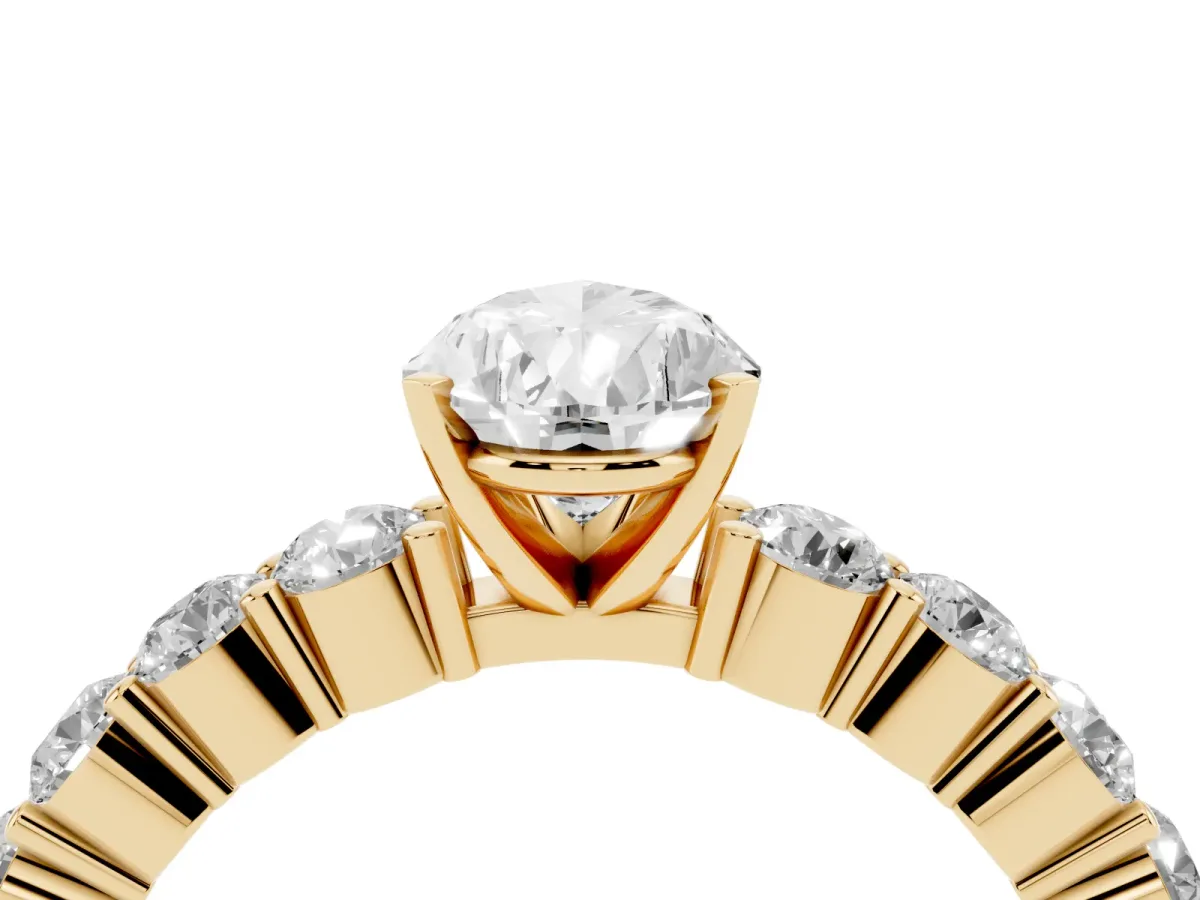 Pear Cut Diamond Solitaire Ring with Shared Prong Round Side Stones Yellow gold