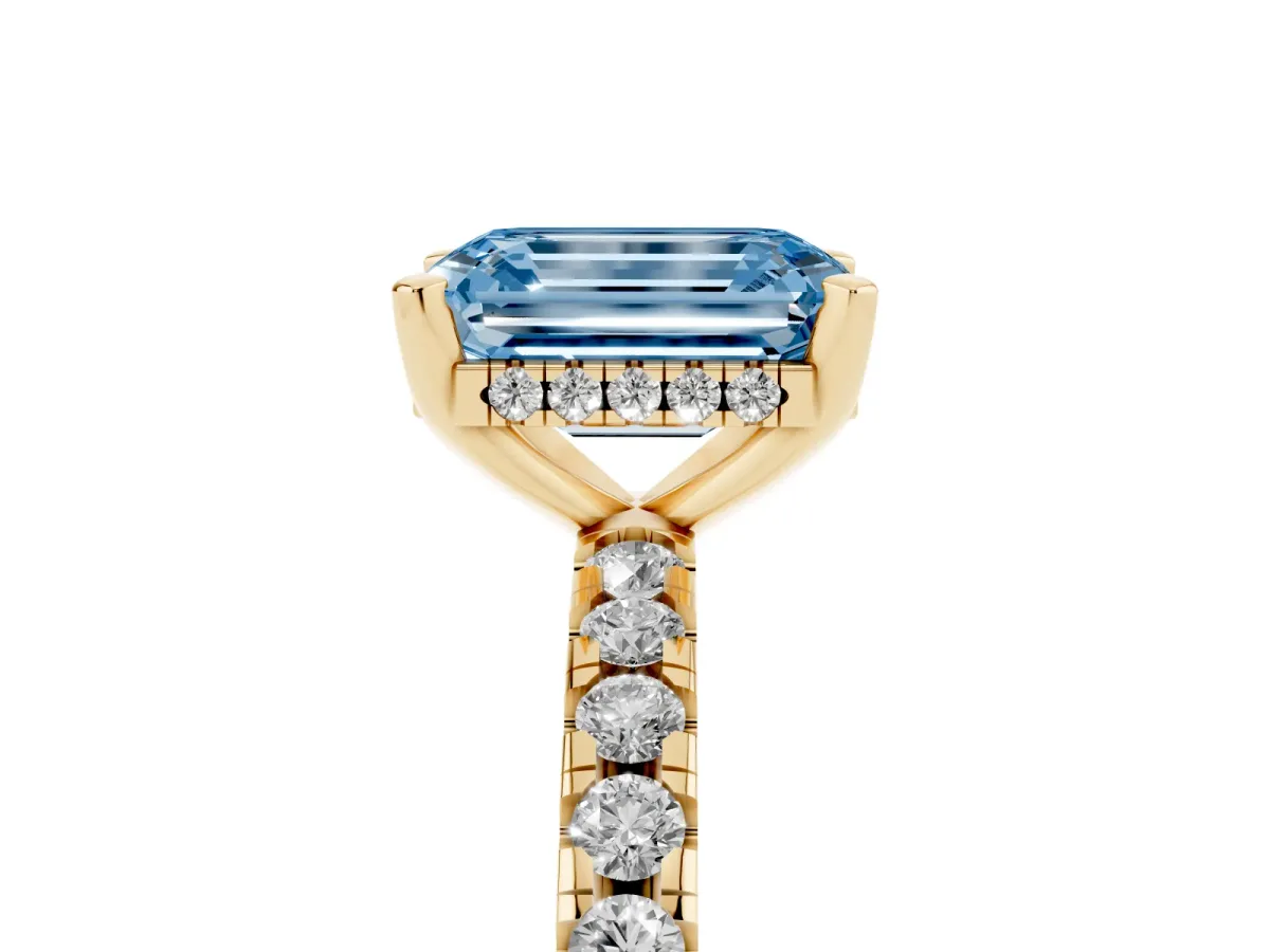 Fancy Blue Emerald Cut Diamond Solitaire Ring with Round Pavé Band and Four-Prong Setting Yellow gold