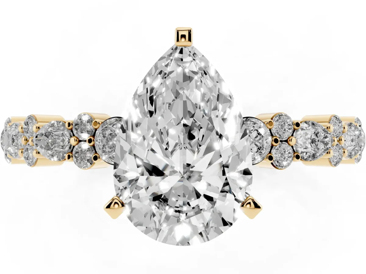 Pear Cut Diamond Side Stone Solitaire Ring with Round and Four-Prong Setting Yellow gold