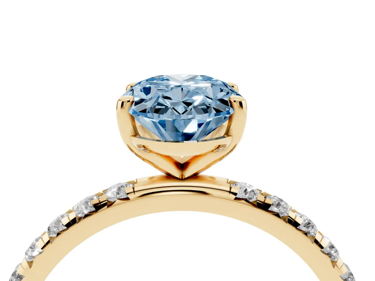 Fancy Blue Oval Cut Cut Diamond Solitaire Ring with Micro Pave Band and Four Prong Setting Yellow gold