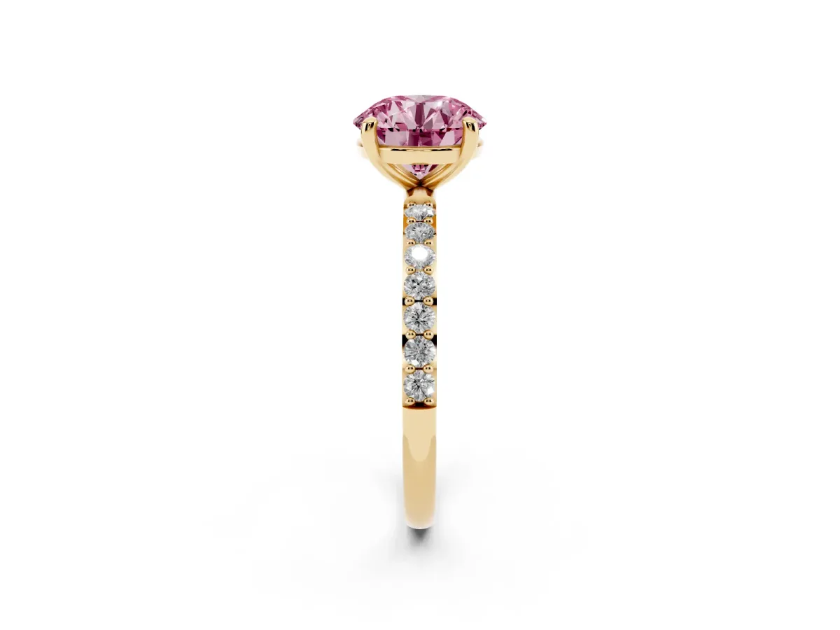 Fancy Pink Round Cut Diamond Solitaire Ring with Round Pavé Band and Prong Setting Yellow gold