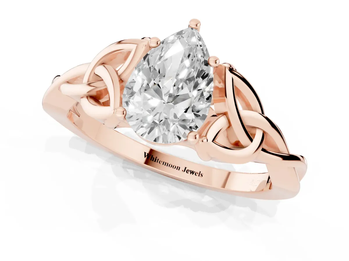 Pear Cut Diamond Solitaire Engagement Ring with Celtic Knot Band and Four-Prong Setting Rose gold