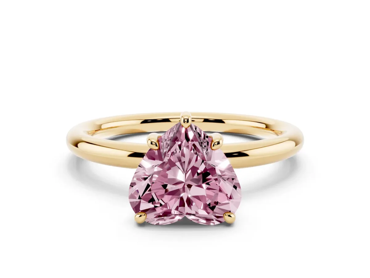 Fancy Pink Heart Cut Solitaire Diamond Ring with Four-Prong Setting on a Plain Band Yellow gold